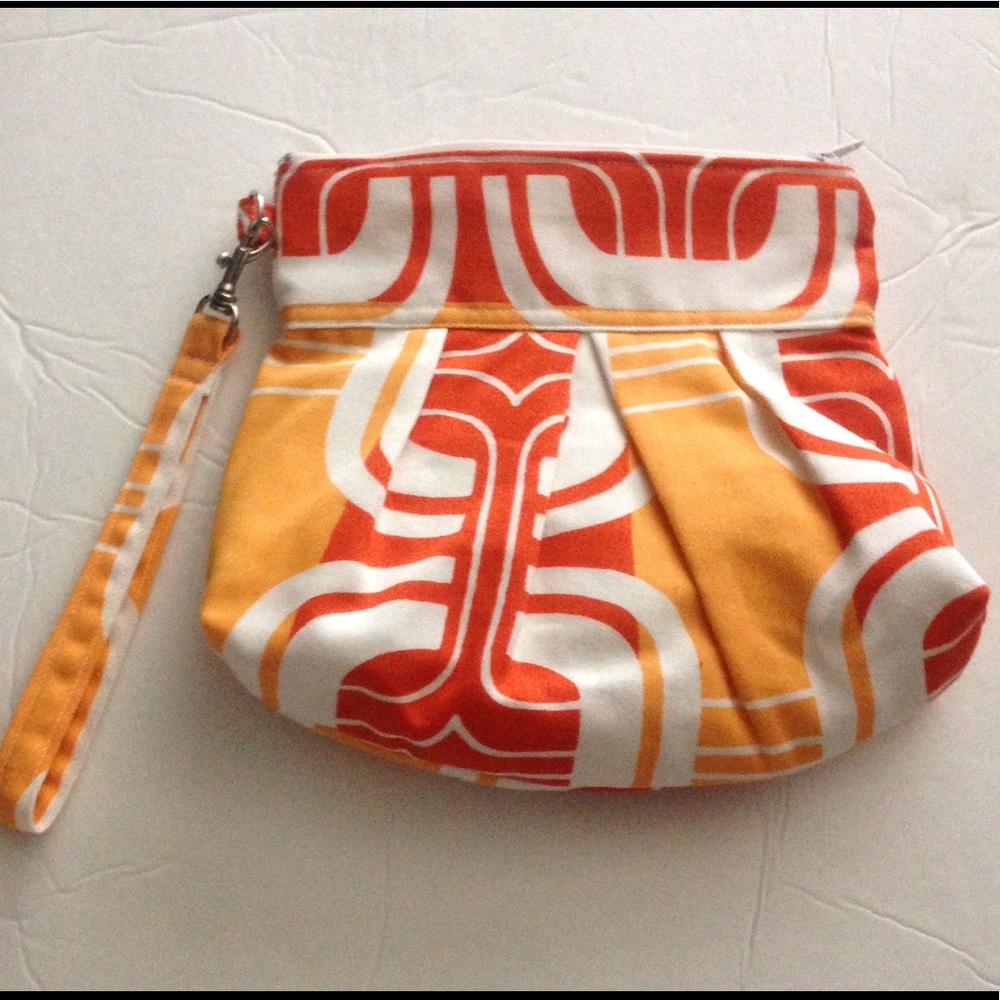 Retro style orange mod print wristlet bag